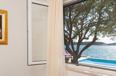 Adorable Beachfront Villa with Pool and Beautiful Garden with Barbecue near Rogoznica