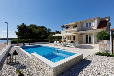Delightful Beachfront Villa with Pool with Heating Possibility near Rogoznica